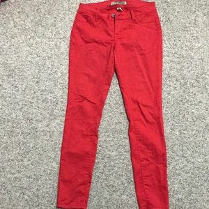 Red skinny legged jean like material